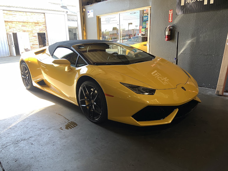 Yellow Lamborghini receiving performance service at Castellon Tires